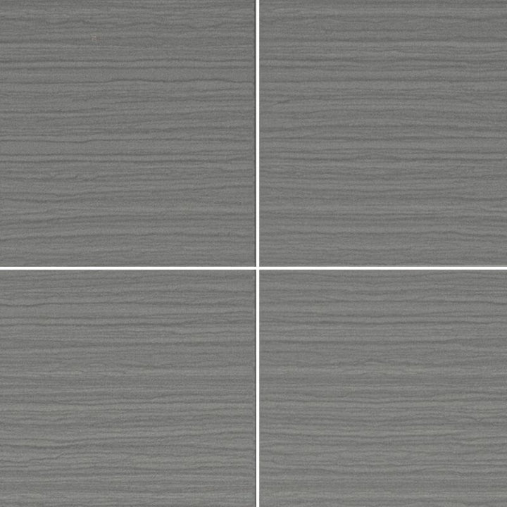 Textured gray ceramic tiles with white grout lines in a grid layout, modern matte finish tile flooring or wall design